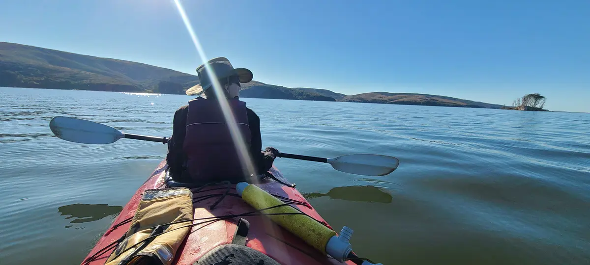 Paddling across the open bay