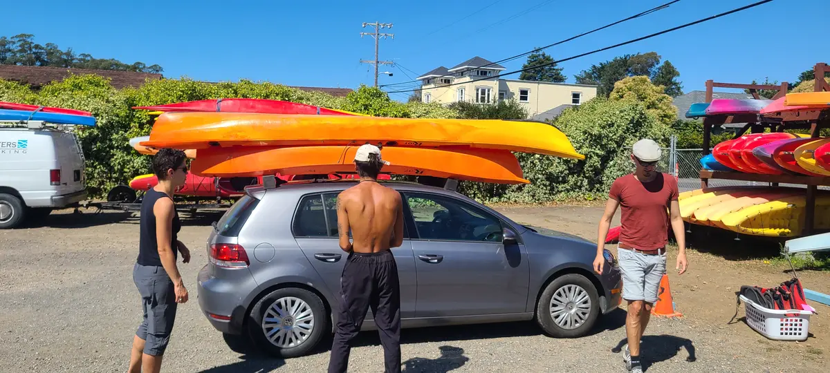 Loading rented kayaks onto the car at Blue Waters Kayaking