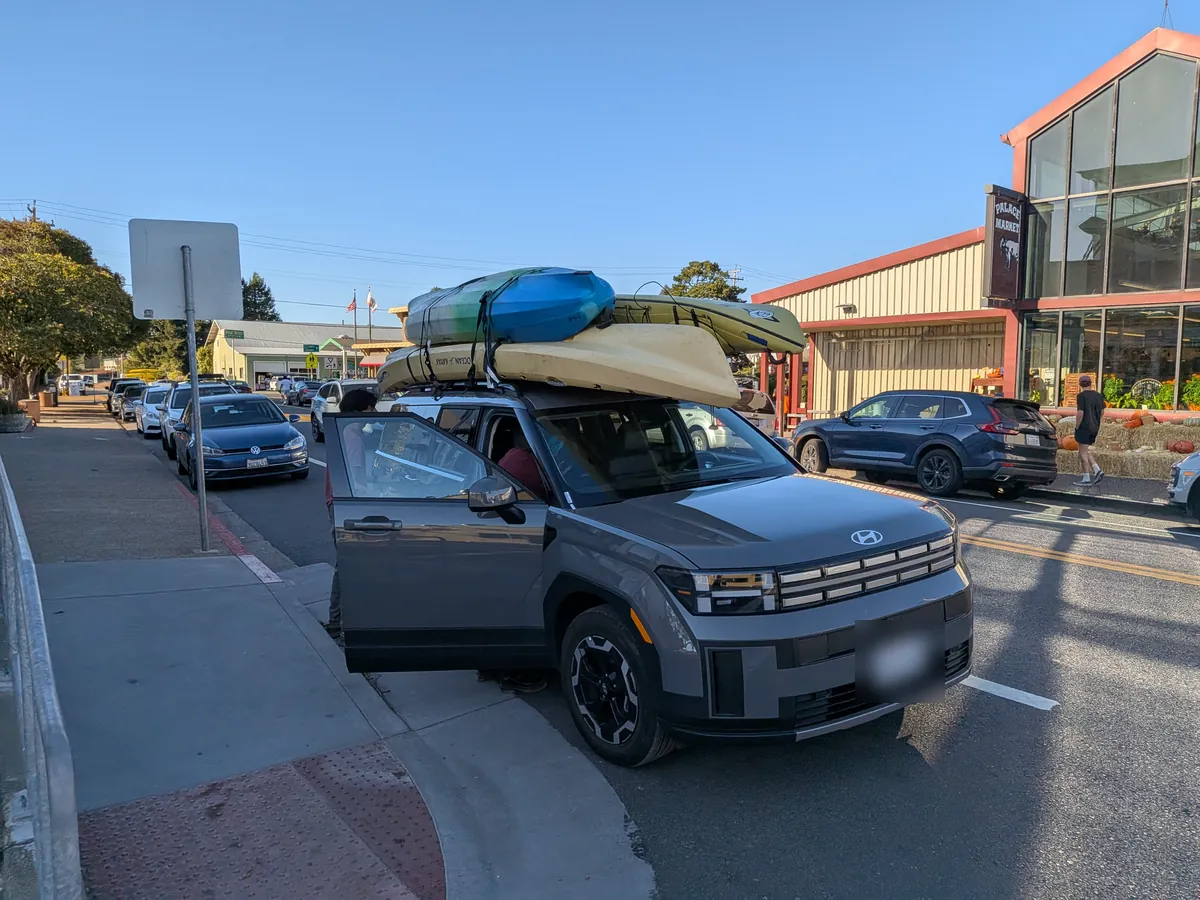 Kayaks strapped to the roof of the car in Point Reyes Station Kayaks strapped to the roof of the car in Point Reyes Station
